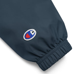 Navy Champion sleeve logo detail on Mountain Faith Co. windbreaker