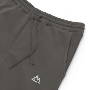 Mountain Faith Co. pigment dyed black joggers front view with minimalist mountain logo