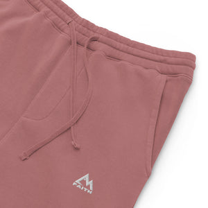 Mountain Faith Co. maroon joggers close-up showing embroidered mountain logo and pocket detail