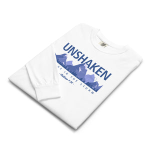 White Folded Unshaken Long Sleeve with storm and solid foundation design inspired by Matthew 7:24 encouraging unshakable faith by Mountain Faith Co.