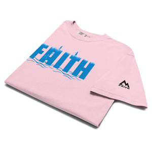 Pink folded Faith T Shirt with illustration of Peter walking toward Jesus on the water symbolizing trust and surrender by Mountain Faith Co.