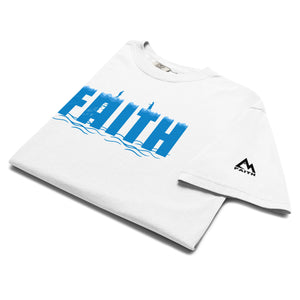 White folded Faith T Shirt with illustration of Peter walking toward Jesus on the water symbolizing trust and surrender by Mountain Faith Co.