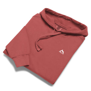 Folded Red Mountain Faith Co. hoodie with small chest logo.