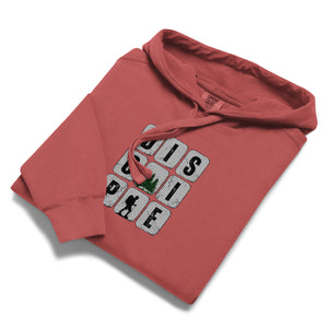 Red folded Disciple Hoodie with bold DISCIPLE lettering representing a committed walk with Jesus by Mountain Faith Co.