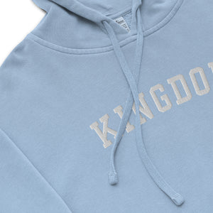 Light blue Kingdom Hoodie with bold KINGDOM embroidery and vintage pigment dyed finish by Mountain Faith Co.